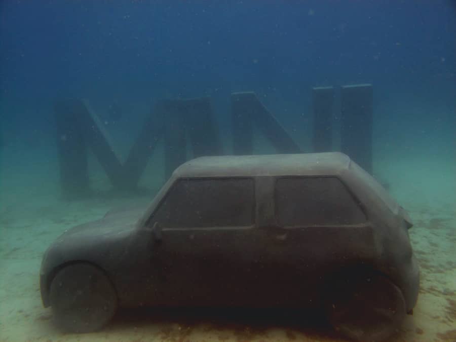Mini car under water representing a CSR project