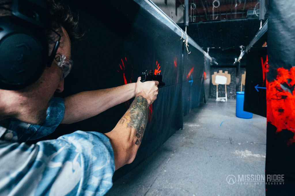 Shooter on the line, red handprints down the bay wall