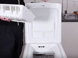Nettoyez la boîte à produit (sur un lave-linge 