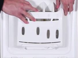 Nettoyez la boîte à produit (sur un lave-linge 