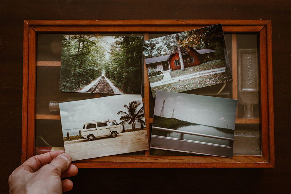 Four photos from a trip in a picture frame.